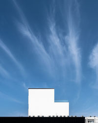 Low angle view of building against blue sky