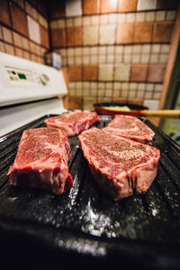 Close-up of meat on barbecue grill
