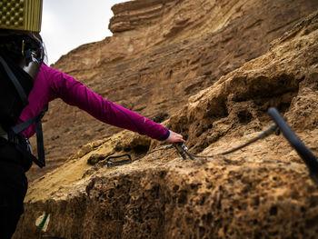 Rear view of woman on rock