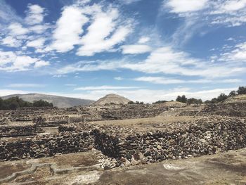 Scenic view of ruins against cloudy sky