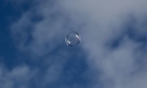 Low angle view of bubbles against moon