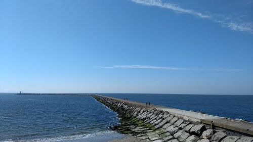 Scenic view of seascape against blue sky