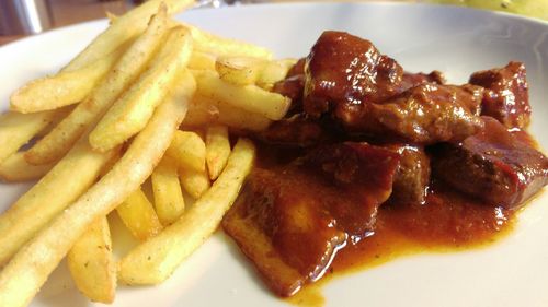 Close-up of meat and vegetables on plate
