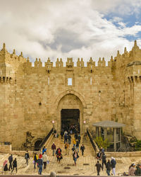 Group of people in front of historical building