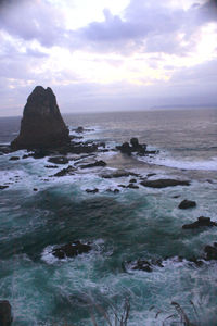 View of calm sea against cloudy sky