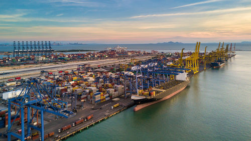 Aerial top view commercial dock freight transportation global business, container ship business