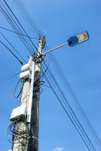 Low angle view of street light against sky