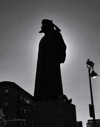 Silhouette of man statue