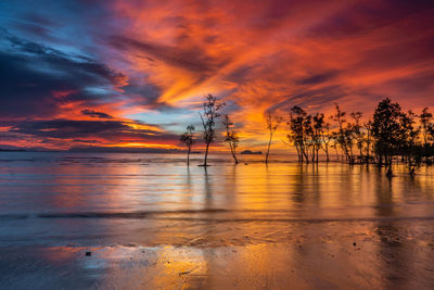 Scenic view of sea against romantic sky at sunset
