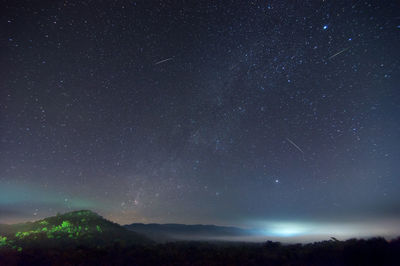 Low angle view of star field against sky at night