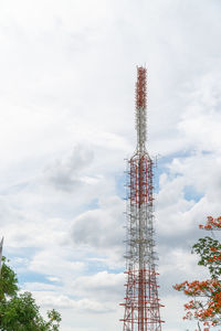 Low angle view of communications tower against sky