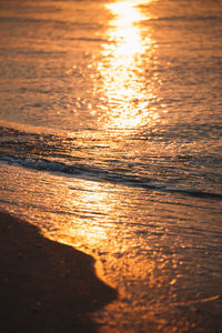 Close-up of sea against sky during sunset
