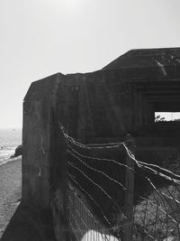 Tilt image of built structure against sky