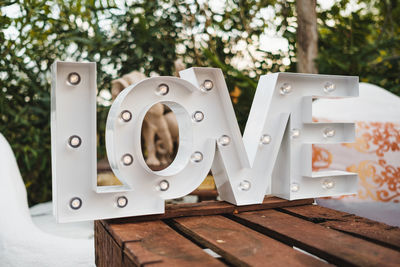 Close-up of love text on table