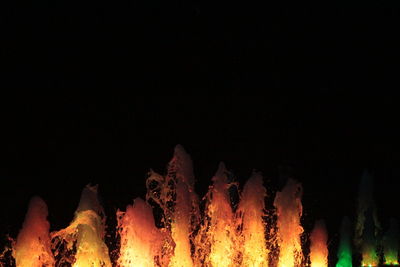 Close-up of bonfire against black background