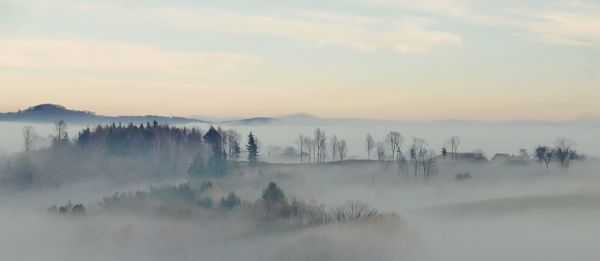 Panoramic view of mountains against sky during foggy weather