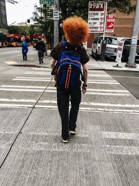 Full length of woman standing in city