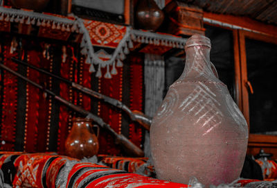 Close-up of illuminated lanterns hanging in building