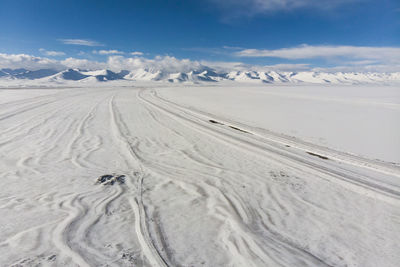 Scenic view of desert against sky during winter