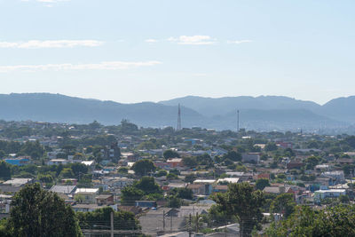 High angle view of buildings in city against sky