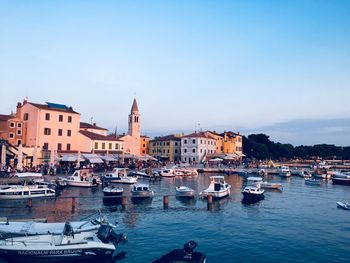 Boats moored at harbor