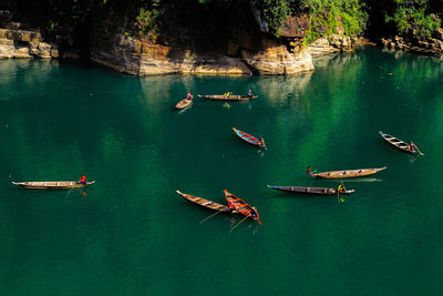High angle view of people in boats on lake
