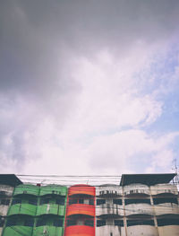 Low angle view aged building with overcast sky