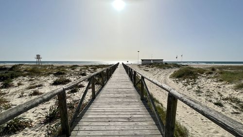 Pier over sea against sky