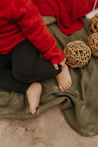 High angle view of baby sitting on floor