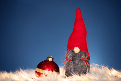 Close-up of christmas decoration against blue wall