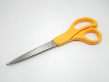 High angle view of yellow metallic structure against white background