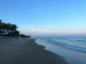 Scenic view of sea against clear sky at sunset