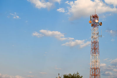 Low angle view of electricity pylon against sky