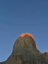 Low angle view of rock formation against clear blue sky. naranjo de bulnes.