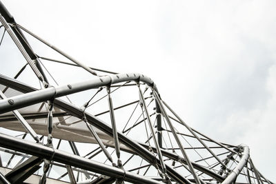 Low angle view of helix bridge against sky