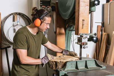 Midsection of man working in kitchen