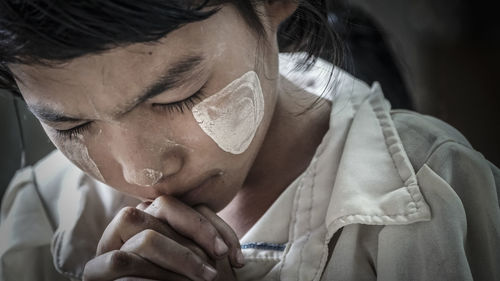 Close-up of girl praying