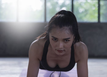 Asian healthy young women at home exercise, fitness.