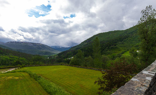 Beautiful lush green summer mountain view of naeroy valley at stalheim hotel in vossestrand, norway.