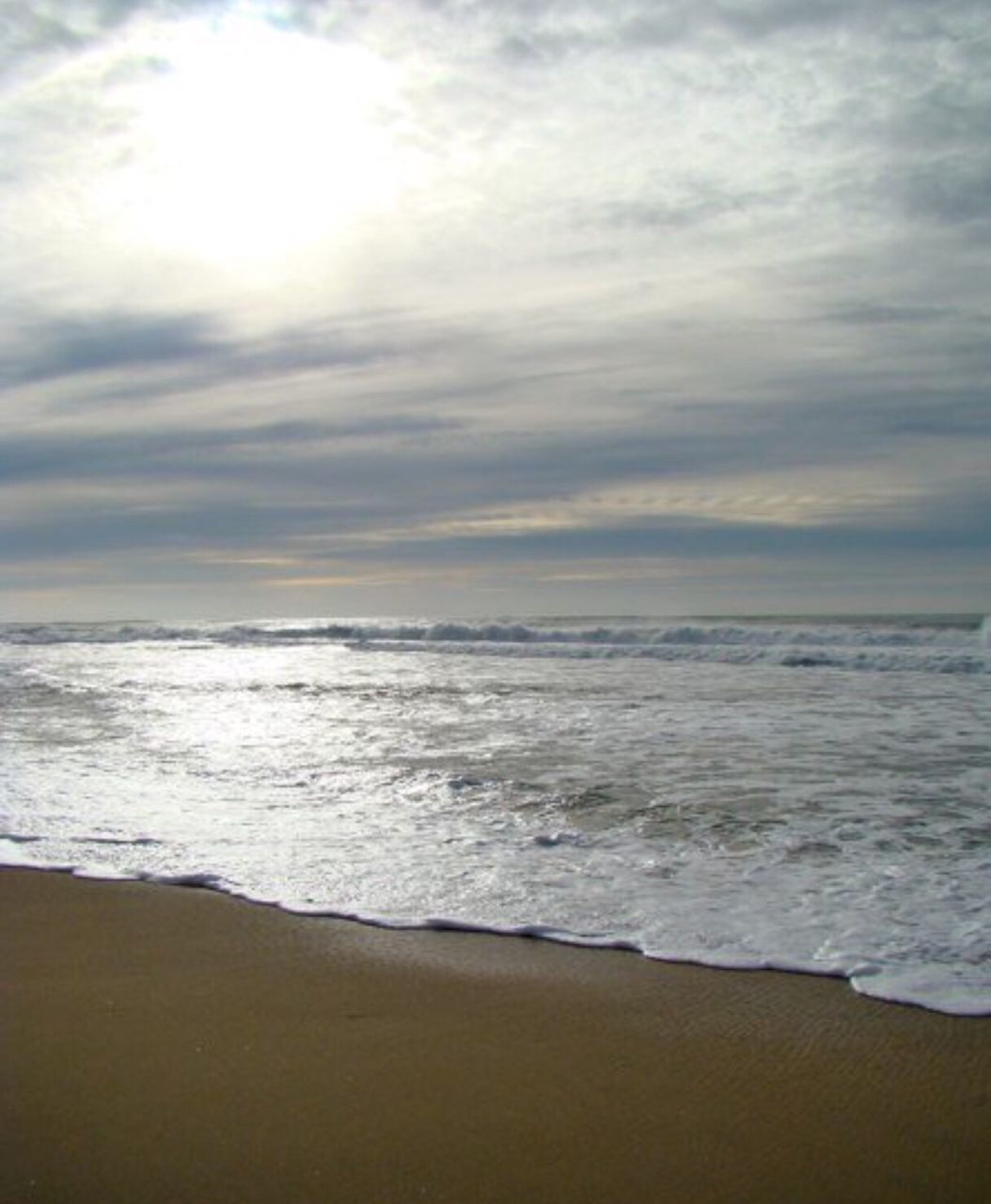 sea, horizon over water, beach, sky, water, scenics, shore, tranquil scene, beauty in nature, tranquility, sand, wave, cloud - sky, nature, idyllic, sunset, surf, cloudy, cloud, coastline