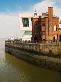 Bridge over river against sky