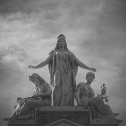 Low angle view of statue against cloudy sky
