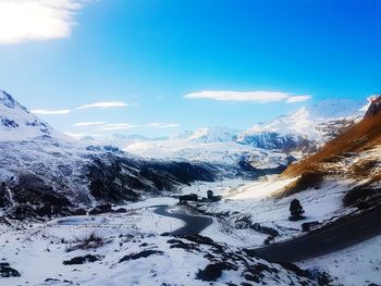 Scenic view of snowcapped mountains against sky