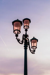 Low angle view of street light against sky