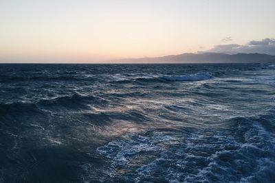 Scenic view of sea against sky at sunset