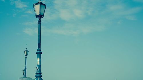 Low angle view of street light against sky