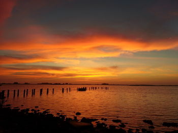 Scenic view of sea at sunset