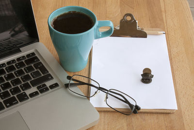 High angle view of coffee cup on table