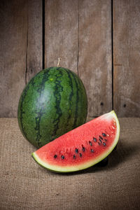 Close-up of fruits on table against white background