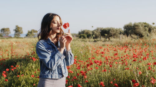 Young woman standing on field